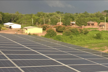 overhead view of solar panels and village